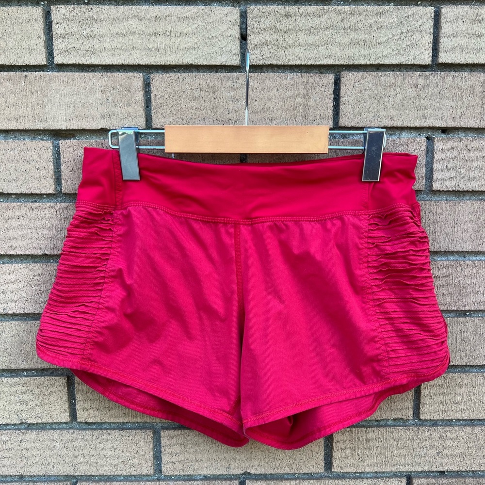 LULULEMON red short shorts, size 6 ruched detail on the sides, lined